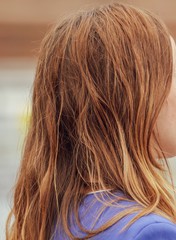 Hair on the head and shoulders of a girl in nature