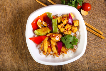Wok with rice, cheese and tofu