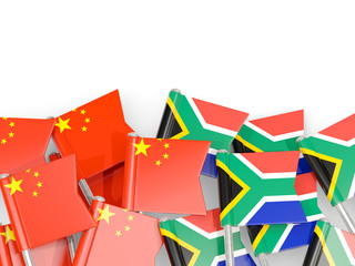 Pins with flags of China and south africa isolated on white.