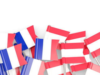 Fototapeta premium Pins with flags of France and austria isolated on white.
