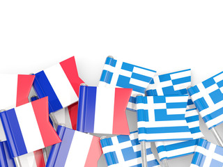 Fototapeta na wymiar Pins with flags of France and greece isolated on white.
