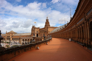 Fototapeta na wymiar The Spain Square (Plaza de España) in Seville, Spain. It is a landmark example of the Regionalism Architecture, mixing elements of the Renaissance Revival and Moorish Revival styles.
