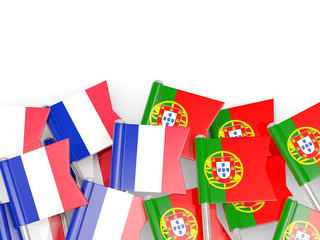 Fototapeta na wymiar Pins with flags of France and portugal isolated on white.