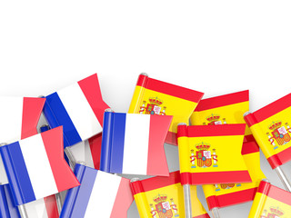 Fototapeta na wymiar Pins with flags of France and spain isolated on white.