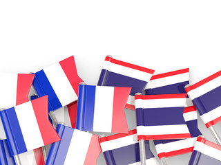 Fototapeta na wymiar Pins with flags of France and thailand isolated on white.