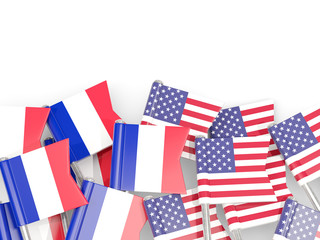 Fototapeta premium Pins with flags of France and United States isolated on white.