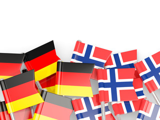 Fototapeta na wymiar Pins with flags of Germany and norway isolated on white.