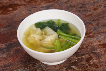 Asian traditional Wonton soup with herbs