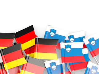 Pins with flags of Germany and slovenia isolated on white.