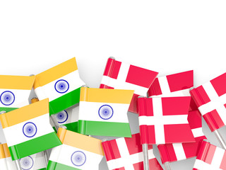 Pins with flags of India and denmark isolated on white.