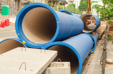Corrugated water pipes of blue color, large diameter, prepared for laying.