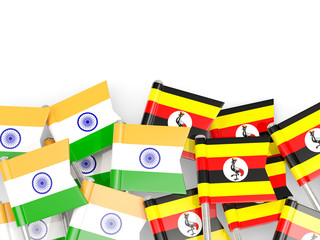 Pins with flags of India and uganda isolated on white.