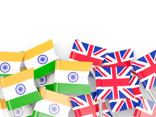 Pins with flags of India and UK isolated on white.