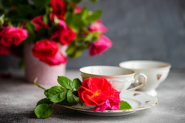 Tea set with red roses