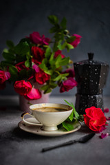 Fototapeta na wymiar Coffee time with red roses