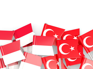 Pins with flags of Indonesia and turkey isolated on white.