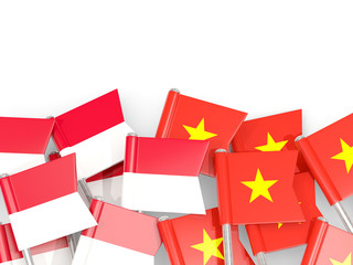 Pins with flags of Indonesia and vietnam isolated on white.