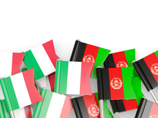 Pins with flags of Italy and afghanistan isolated on white.