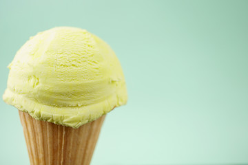 Ice-cream scoop in waffle ice cream cone with copy space. Summer background, vacation, refreshment,...