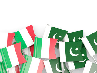 Pins with flags of Italy and pakistan isolated on white.