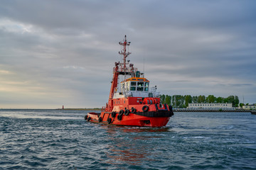 Fototapeta premium Port of Gdansk, Poland, tug on the way to the mooring