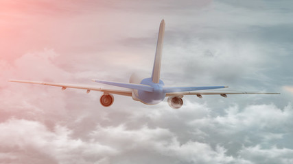 3D rendering of a commercial airplane on flight over the clouds