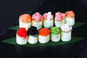Seafood delicatessen sushi rolls on slate. Different gourmet snacks. Luxury lifestyle, Japanese food art, expensive meals, restaurant menu