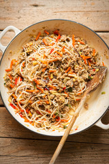 Chinese pork noodle stir fry with egg noodles and vegetables