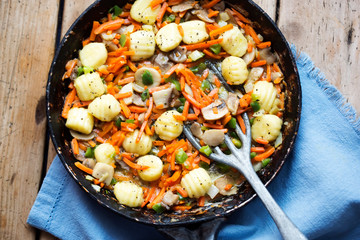 Gnocchi with vegetables and mushrooms. Potato dumplings with carrot, scallions & mushrooms 