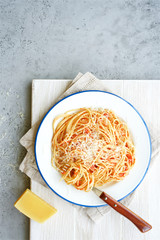 Italian pasta spaghetti with tomato sauce or marinara on light background
