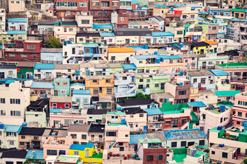 Scenic landscape of Gamcheon Culture Village, colorful and artistic tourist attraction with brightly painted houses on hillside of coastal mountain in Saha District, Busan, South Korea