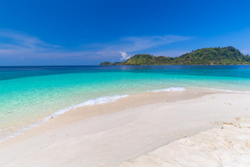 Fototapeta na wymiar Tropical beach paradise and the blue sky at Khai Island in Satun Province , Thailand