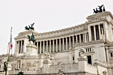 Fototapeta na wymiar Altar of the Fatherland or Vittoriano in Piazza Venezia in Rome. Large monument with colonnade made of Botticino marble.