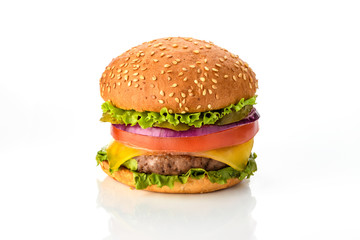 Big fresh tasty burger on wooden board isolated on white background