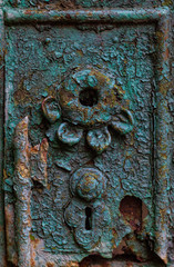 A forged keyhole with a flower