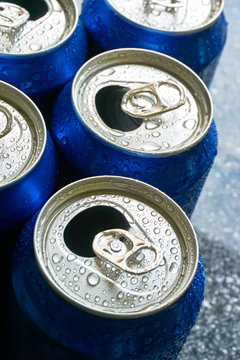 Close Up Of Blue Soda Cans With Open Pull Tab And Condensation Or Water Drops