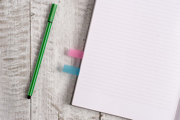 Thick pages notebook stationary placed above classic look wooden backdrop