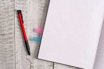 Thick pages notebook stationary placed above classic look wooden backdrop