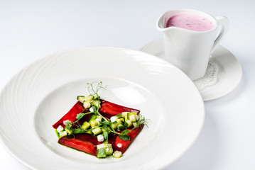 cold beetroot soup on the white background