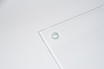 Transparent glass plate with holes