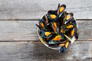 Delicious seafood mussels with  parsley sauce and lemon. - Powered by Adobe
