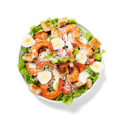 Caesar Salad with Shrimp isolated on white background .