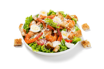 Caesar Salad with Shrimp isolated on white background .
