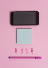 Colored blank sticky note clips smartphone pen trendy pastel background