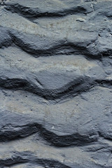 The Ribbs and the waves carved on a concrete wall