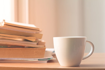 Cup of coffee with stack document on office desk.Copy space.