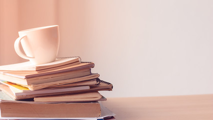 Cup of coffee with stack document on office desk.Copy space.