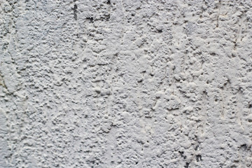 White bits texture on a concrete wall