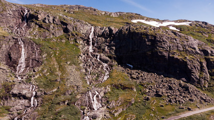 Waterfall in mountains. Norwegian route Sognefjellet