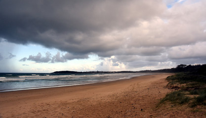 Panoramic landscape of Arrawarra, Arrawarra Headland and beach in New South Wales, Australia on a cloudy and rainy day before storm.